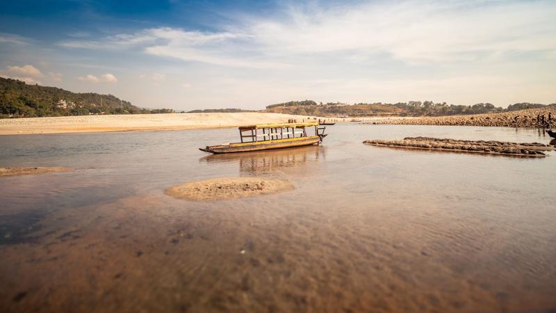 Jaflong boat on the river with green hills